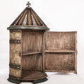 Cylindrical cabinet with rotating top opened